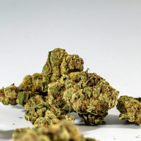 Detailed image of dried cannabis buds against a clean white background.