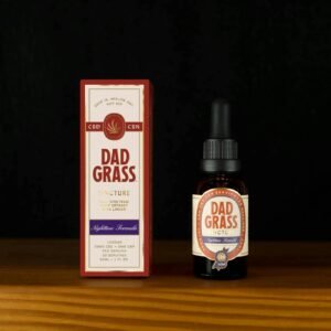 High-quality still life of Dad Grass CBD tincture highlighting packaging and bottle.